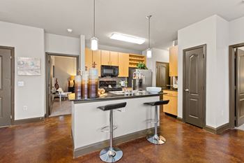 kitchen with island, track lighting and pendant lighting